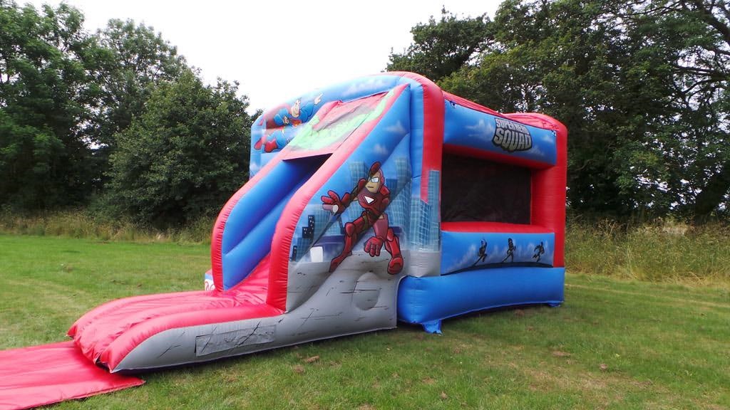 Deluxe Superhero Bouncy Castle with Front Slide Bouncy Castle Hire in