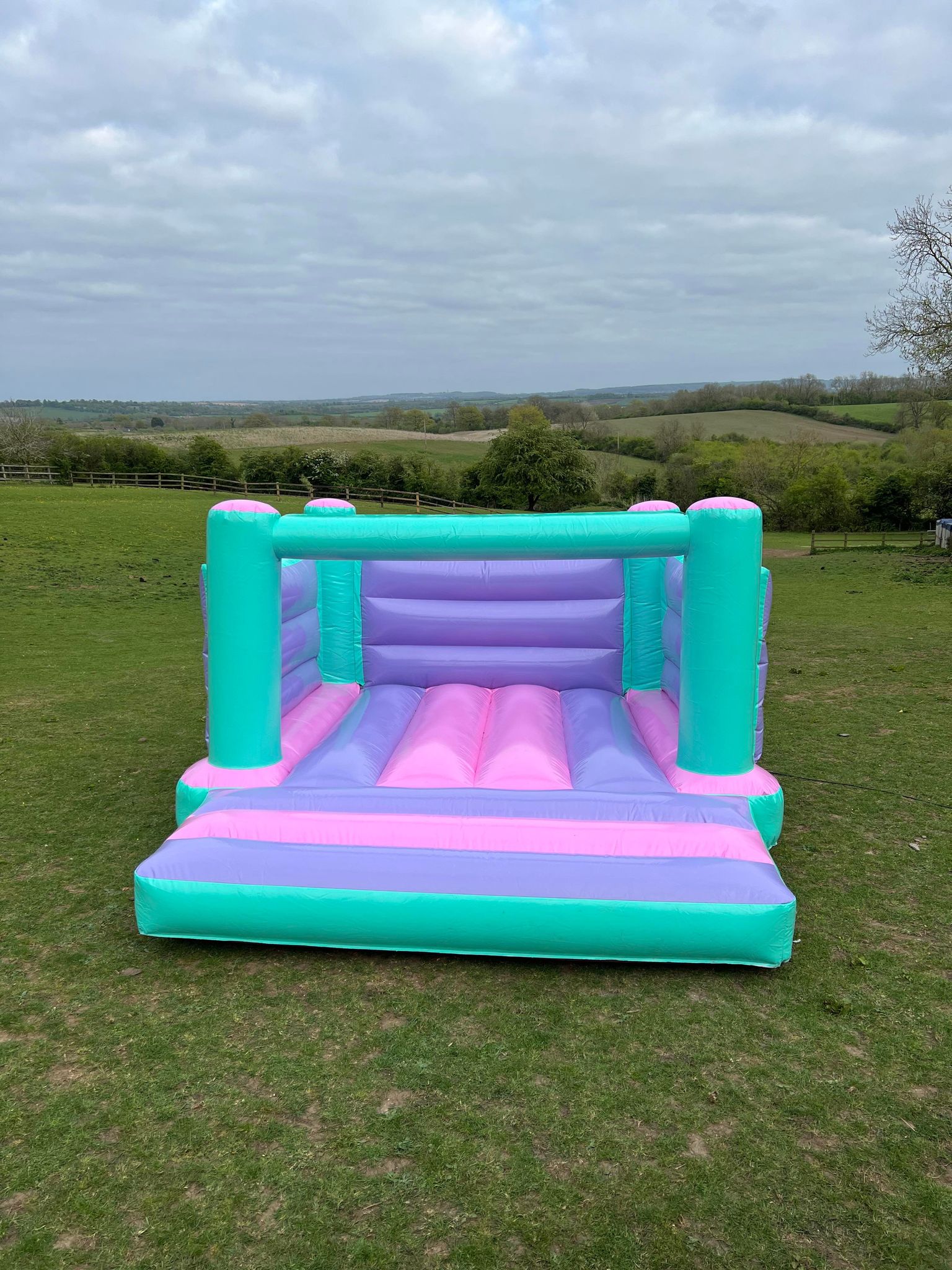 Colourful pastel castle - Bouncy Castle Hire in Milton Keynes 