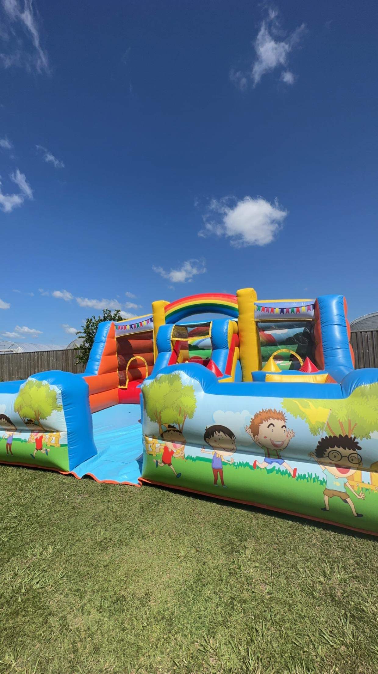 Rainbow Playland with Ball Pit Best Jumping Castle Hire, Face