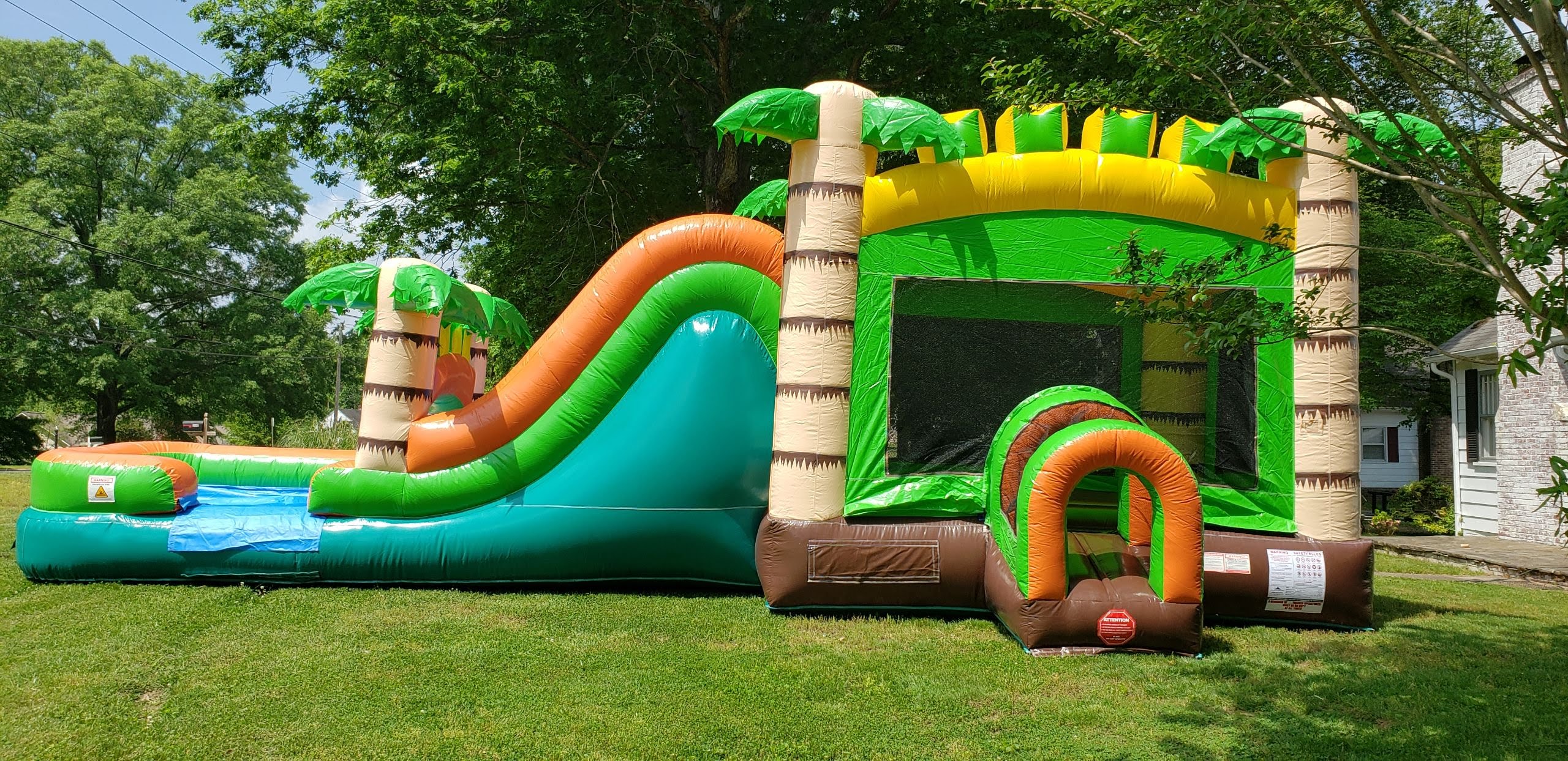Mega Tropical Slide with Landing Pad Best Bounce House Rentals