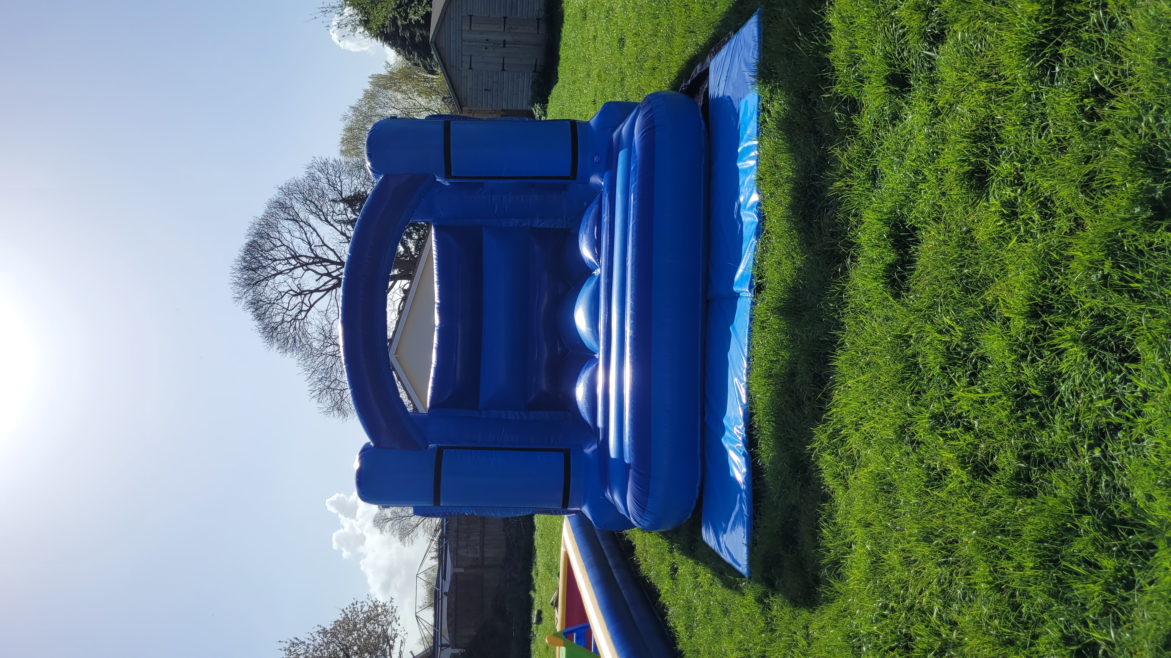 Blue Low Height Bouncy Castle Hire | Safe & Fun Inflatable for Kids