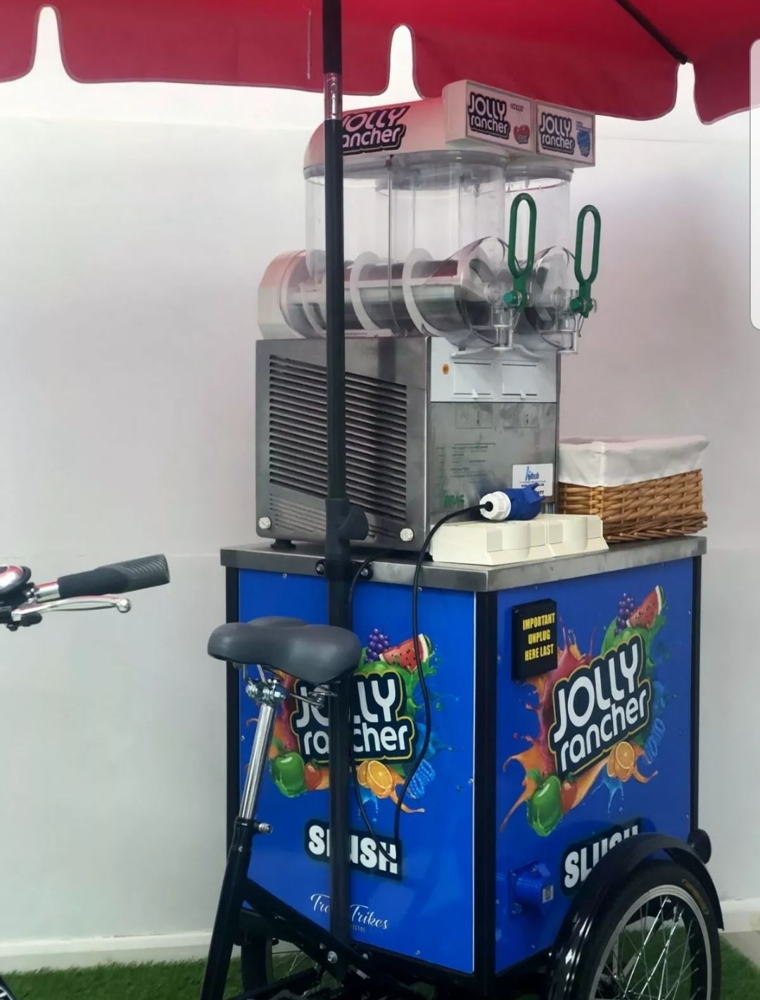 Slush machine with Trike and Parasol. Best Bouncy Castle Hire service