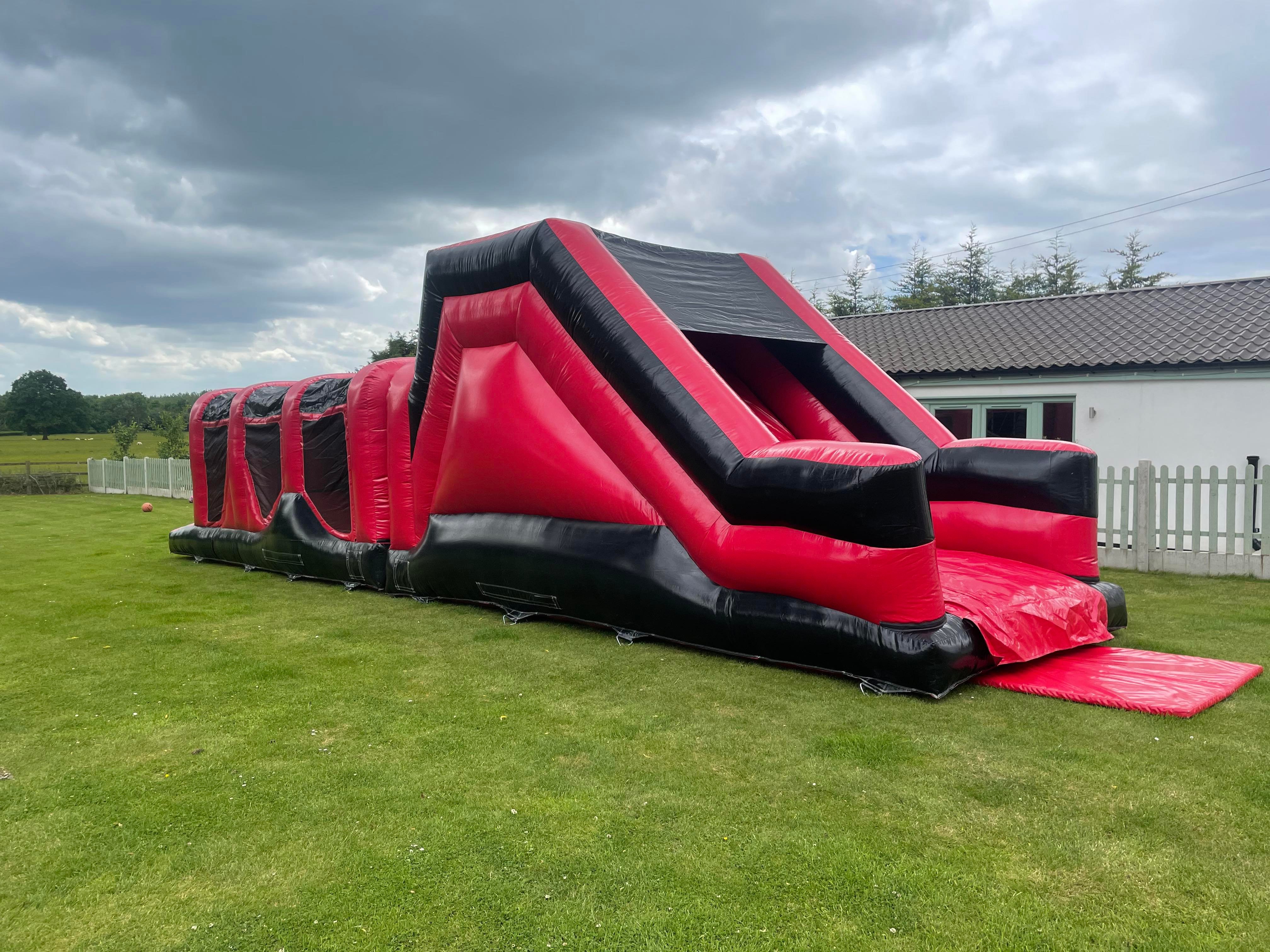 Inflatable assault course hire from ARC Bouncy castles