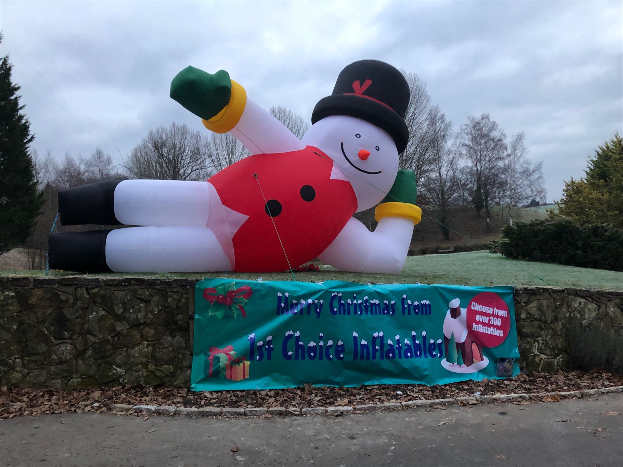 Relaxing Snowman Christmas Inflatable 26ft Wide Bouncy Castle Hire in