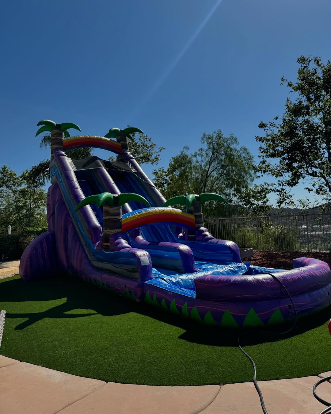 Tall inflatable water slide for a warm-weather Eastvale party