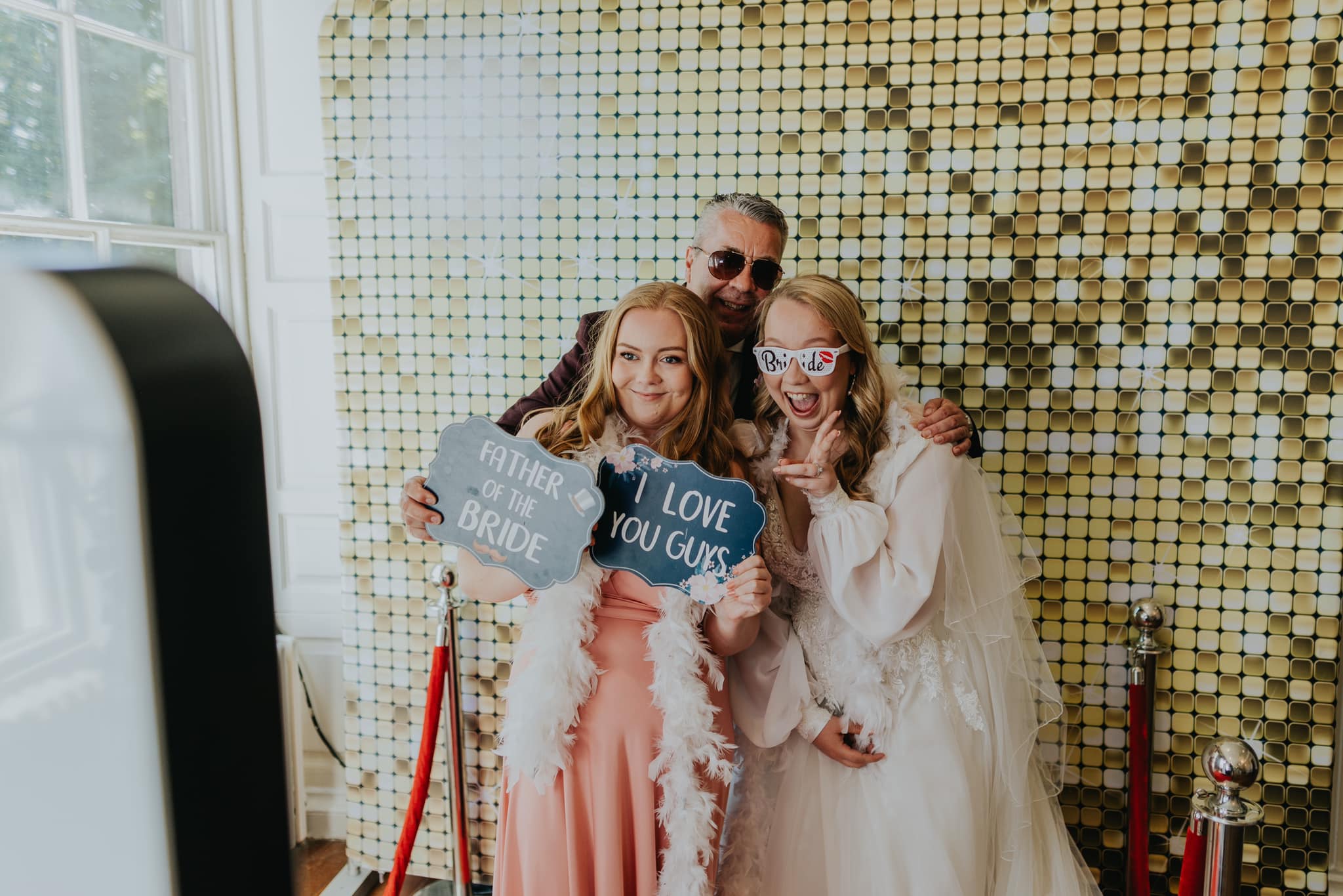 Bride and guests using the photo booth at a Nottingham wedding