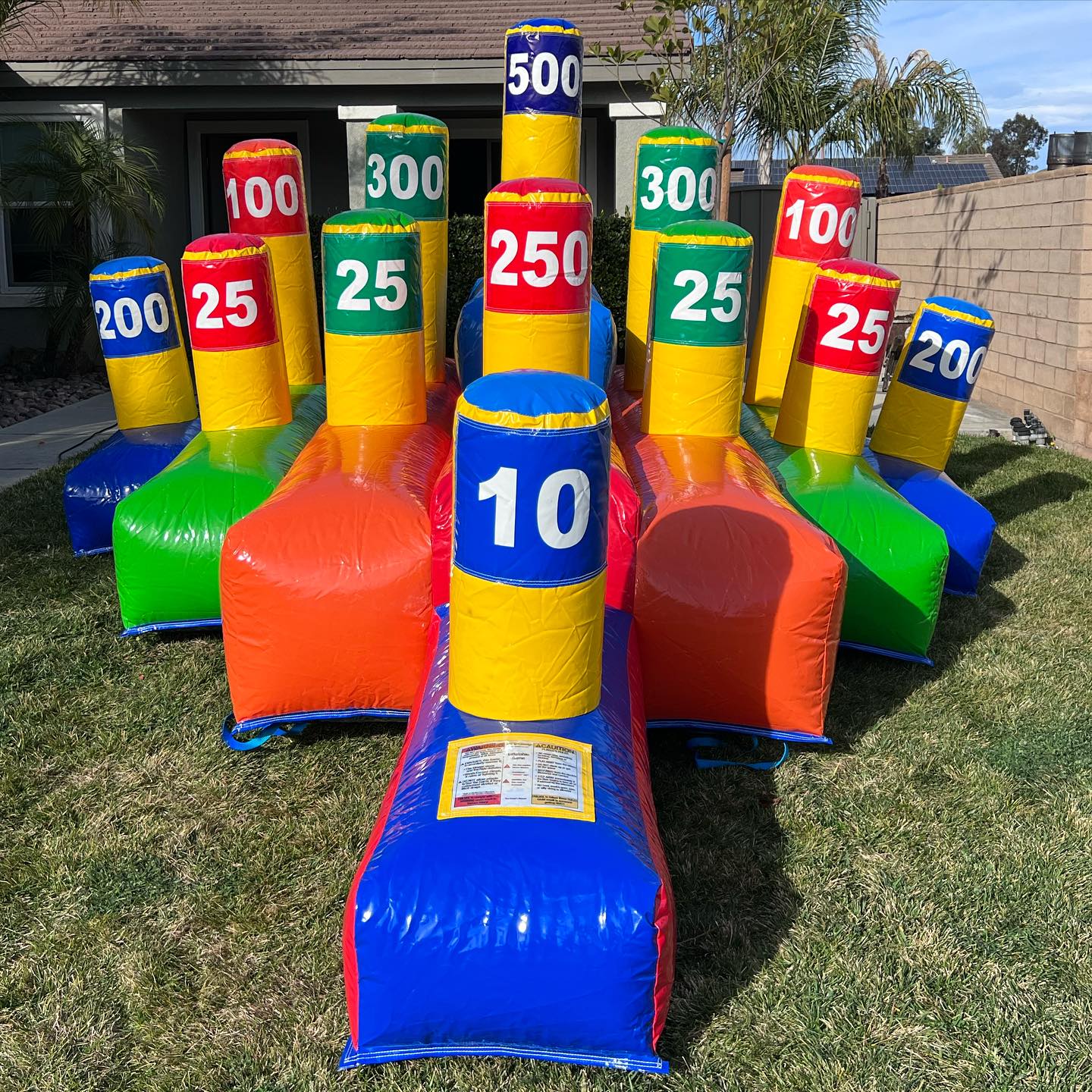 Colorful inflatable carnival game with numbered targets for parties and events