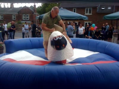 Rodeo sheep ride at a pub garden event