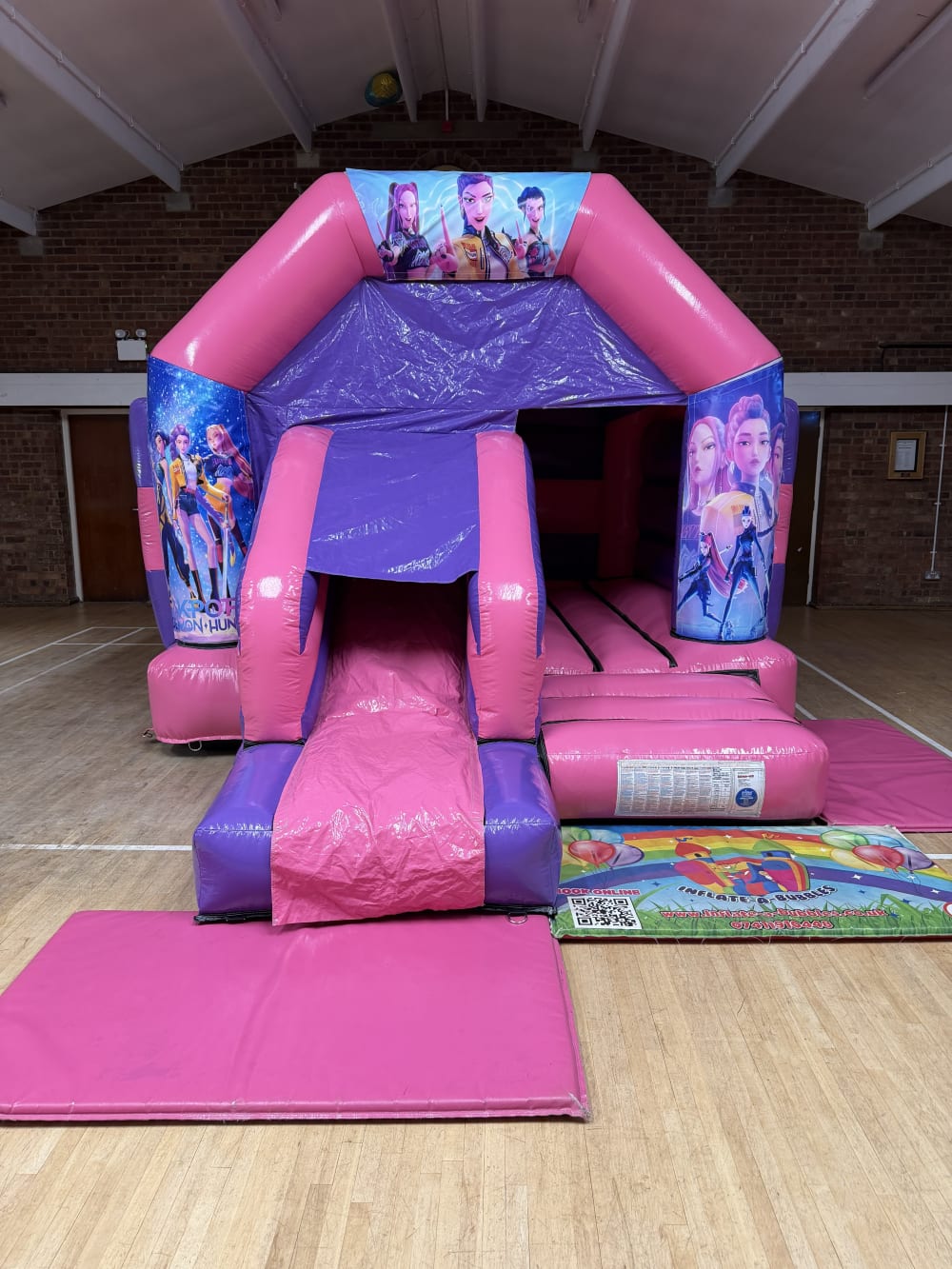 K Pop Demon Hunters Bouncy Castle pink and purple front slide