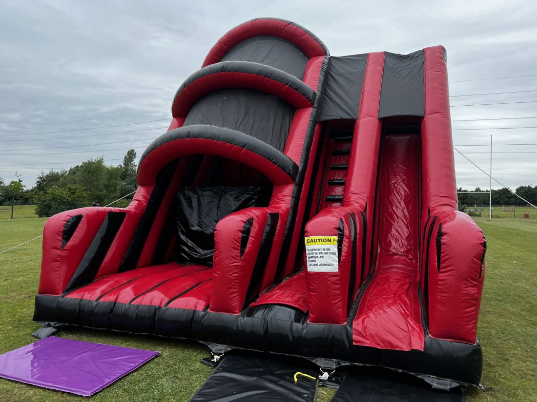 A red bouncy castle in the middle of a beautiful square in Paris