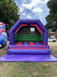 Adult Bouncy Castle Purple, Red & Green hire