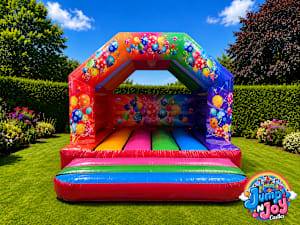 Multi Coloured Party Theme Bouncy Castle