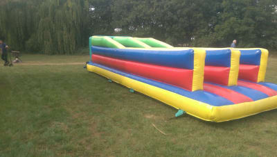Bungee Run, a assault course for hire from Wallington Bouncy Castles
