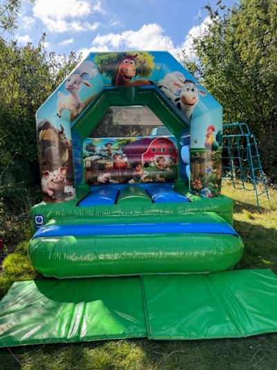 Farm Castle (10ft x 10ft), a bouncy castle for hire from Elmbridge Inflatables