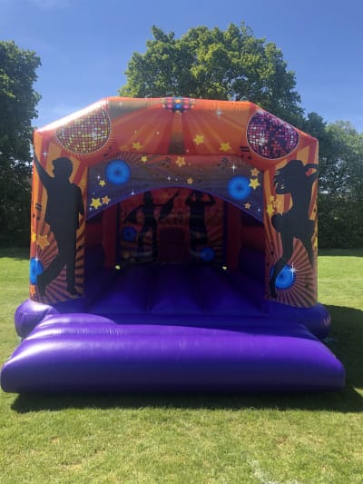 Open Front Disco Bouncy Castle, a bouncy castle for hire from Rick's Castles