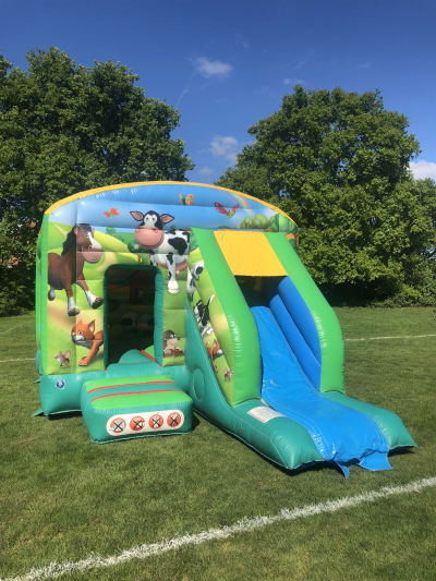 12ft x 18ft Farmyard Bounce House Slide Combo, a bounce and slide combo for hire from Rick's Castles