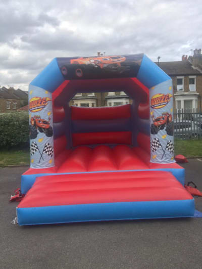 11 x 15ft Blaze monster machine Bouncy Castle, a bouncy castle for hire from SK Hire Events