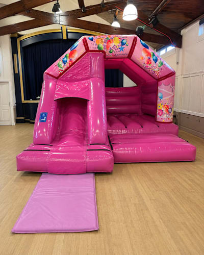 12ft x 15ft Pink Party Bounce & Slide, a bounce and slide combo for hire from Wizard Bouncy Castles