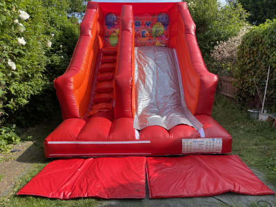 12 x 15 x 15 x 6ft party themed Slide, a inflatable slide for hire from TFG Bouncy Castles