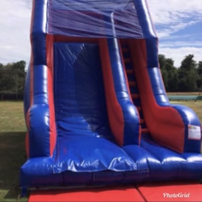 Red and blue slide, a inflatable slide for hire from Harry's Quads 'N' Castles