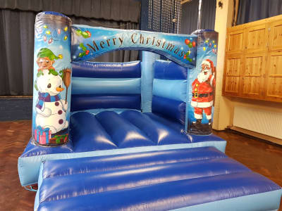 11ft x 13ft Low Height Christmas Castle, a bouncy castle for hire from Abc Party Hire