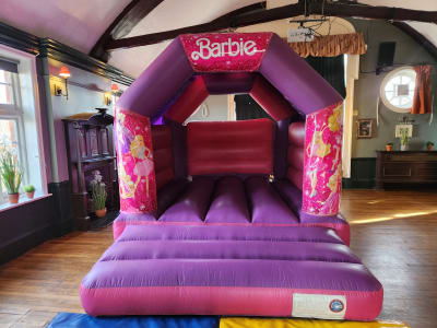 BARBIE BOUNCY CASTLE 15FT vs 11ft, a bouncy castle for hire from All Bounce Surrey