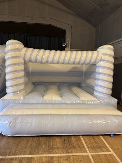 Blue and White Candy Cane Bouncy Castle, a bouncy castle for hire from Bounce House Inflatables