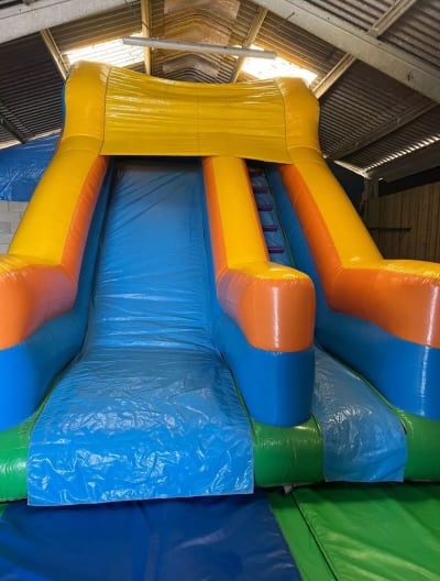 Orange and blue slide, a inflatable slide for hire from Bounce About Sussex
