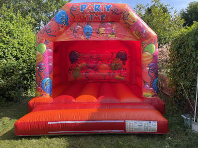 12 x 12 ft Red Party Themed Bouncy Castle (Medium), a bouncy castle for hire from TFG Bouncy Castles