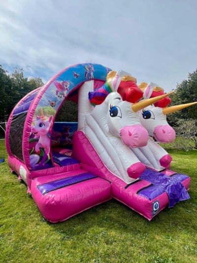 Unicorn Bounce N slide, a bounce and slide combo for hire from Bouncy Mania