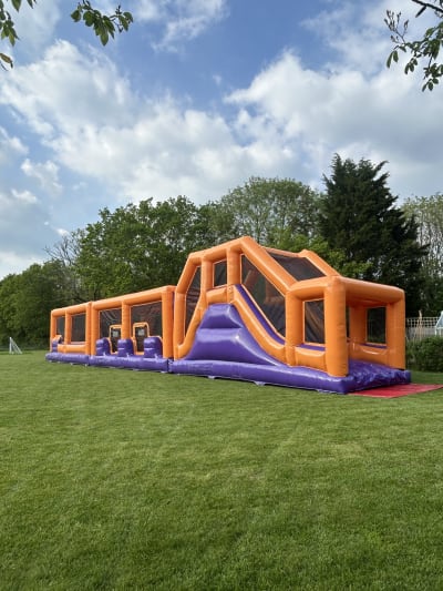 70ft Purple and Orange Challenge Obstacle Course, a assault course for hire from Crockerz Castles