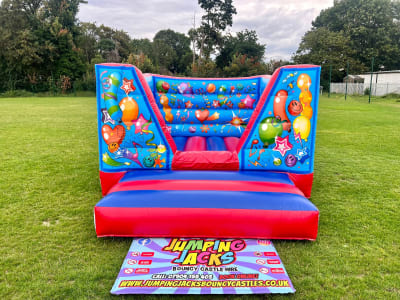 10x13 Red & Blue V Front, a bouncy castle for hire from Jumping Jacks Bouncy Castles