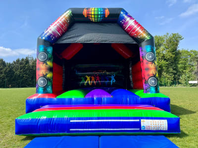 Large Disco Theme Castle 15x17, a bouncy castle for hire from Jumping Jacks Bouncy Castles