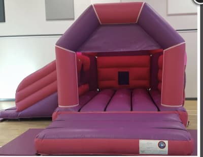 13x16 Gloss Pink And Purple Slide Bouncy Castle, a bounce and slide combo for hire from Wallington Bouncy Castles