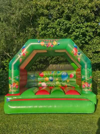 Green & Red Bouncy Castle (15 x 16), a bouncy castle for hire from Cookes Castles
