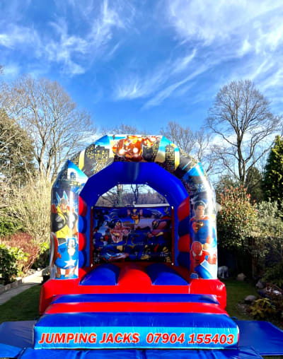 10x13 Superheroes, a bouncy castle for hire from Jumping Jacks Bouncy Castles