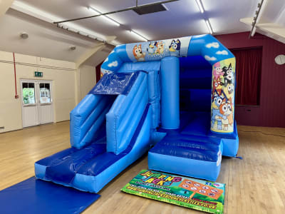 Bluey Blue Velcro with Slide, a inflatable slide for hire from Jumping Jacks Bouncy Castles