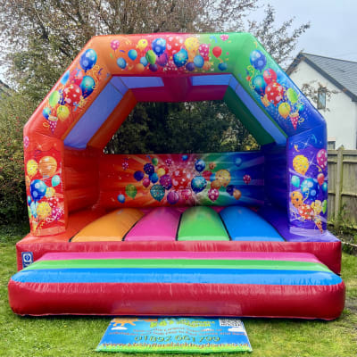 Large Multi Coloured Party Bouncy Castle, a bouncy castle for hire from KBS Inflatable Kingdom