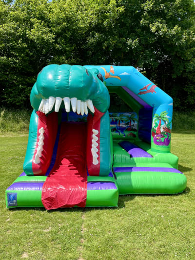 3D Dinosaur Combo Bouncy Castle, a bouncy castle for hire from Cookes Castles