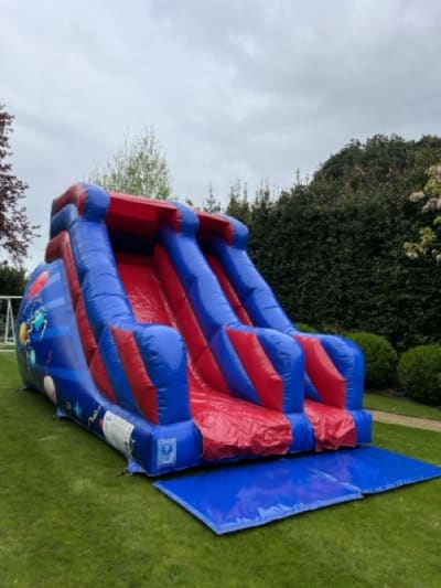 8ft Party Red/Blue Slide, a inflatable slide for hire from Elmbridge Inflatables