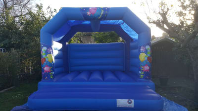 BALLOONS BLUE BOUNCY CASTLE 15FT vs 15ft, a bouncy castle for hire from All Bounce Surrey
