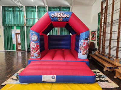 CHRISTMAS BOUNCY CASTLE 15FT vs 11ft, a bouncy castle for hire from All Bounce Surrey