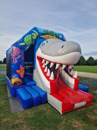 4D Shark Castle with Slide, a bounce and slide combo for hire from Every Bounce Counts