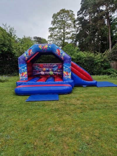 Party Combi Castle (Side Slide) - 13 x18ft, a bounce and slide combo for hire from Airscape Events