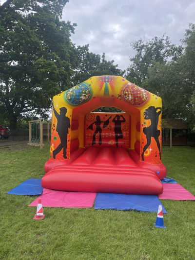 Red & Yellow Adult Disco Themed Bouncy Castle, a adult bouncy castle for hire from Bounce N Fun