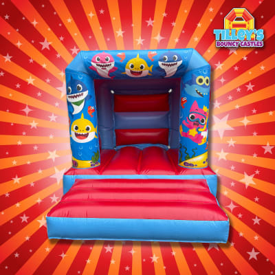 Baby Shark Bouncy Castle (Red & Blue Slim), a toddler inflatable for hire from Tilley's Bouncy Castles and Soft Play Hire