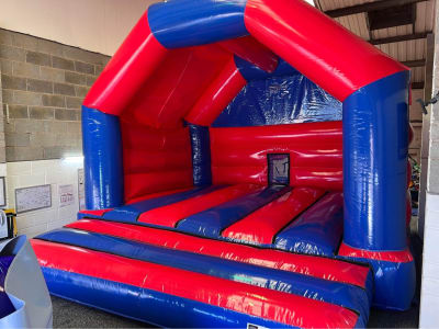 Red & Blue Disco Adult Bouncy Castle, a adult bouncy castle for hire from Tilley's Bouncy Castles and Soft Play Hire
