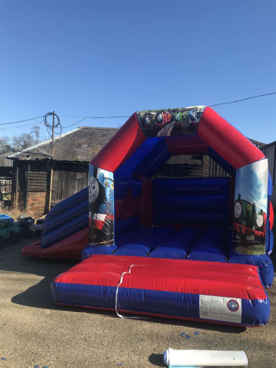 13x16 Thomas The Tank Engine Castle With Slide, a bounce and slide combo for hire from Kingies Castles