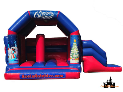 Christmas Themed Red and Blue Bounce and Slide 15ft x 21ft, a bounce and slide combo for hire from Ace Inflatables