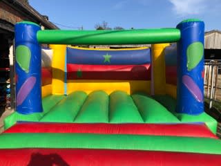 Multi Coloured Bouncy Castle, a bouncy castle for hire from Happy Days Bouncy Castles